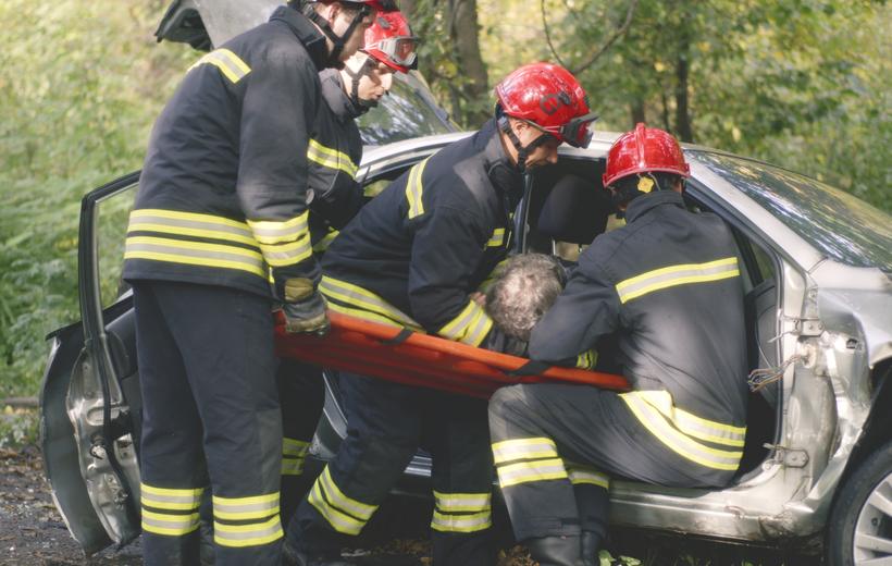Emergency responders assisting a crash victim